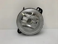 Up for sale is a good working part. It is a front fog light. This is a genuine authentic OEM CHRYSLER part. All parts...