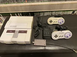 Super Nintendo Entertainment System. SNES. Tested Works. 2 Controllers All Cords. Selling this SNES. NO RESERVE. Cables...