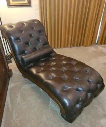 Beautiful chaise lounge in deep brown plush leather with wood trim and legs. Excellent condition. Local Pickup Only.