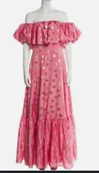 Make a statement at your next formal occasion with this stunning pink and gold polka dot ball gown from Monique...