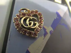1 GUCCI HEART CHARM. WITH PINK RHINESTONES.