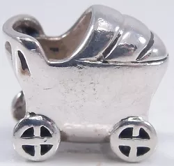 This authentic Chamilia Baby Carriage charm bead is Chamilia #GA-61. A sterling silver old fashion style baby carriage....