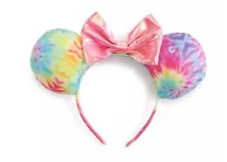 Disneys Minnie Mouse novelty headband. This cute headband features Minnie Mouse Ears with a tye dye bow knot. The ears...