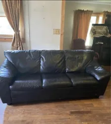 3 seat black leather sofa, comfortably worn and without defects. Soft and cushions have no uneven wear.