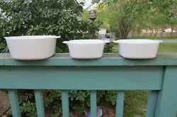 They are white with no decoration, with 2 handles. Under one of the handles on all dishes, it says Corning Ware, Made...