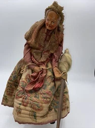 Santon de Simone JOUGLAS.Il s’agit des premiers santons produits.La chaise n’est pas d’origine.En bel état Vendu...