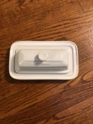 This Le Creuset Butter Dish is made of high-quality stoneware and comes in a glossy white finish. It has a rectangular...