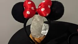 Minnie Mouse Ears lot of two. The Minnie Ears with red bow is from the park with a tag( see picture) and is Adult size....