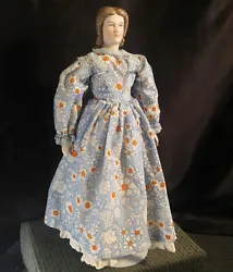 • Dress is blue with white/orange flowers in a small chintz print. = Porcelain Bisque Head & Hands =. • VERY NICE...