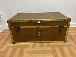 Vintage Steamer Trunk.Beautiful original light brown covering with gold accents. Nice rivets and bumpers on corners and...