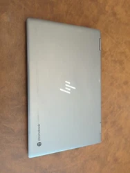 The laptop/tablet is in excellent condition and is silver in color.