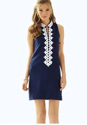 Solid sleeveless shift dress with zipper and lace detail at front.35