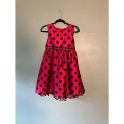 Beautiful childs party dress in fuchsia color with black polka dots, back tie and button closure. Size 12 Measures 16