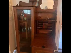 Antique secretary with drop-down desk and hutch. This hutch has the original key. There is a blemish on the front top....