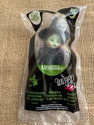Still in sealed plastic bag. black hair and green eyes. The Item in the photos is the one you will receive.
