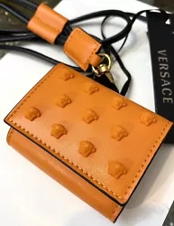 versace orange leather /medusa studs airpods holder. Super cute with its rubber Medusa studs all over the front, golden...