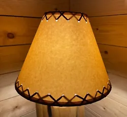 Rustic Oiled Kraft Paper Lamp Shade with lacing on top and bottom. Note: Shade is shown both lit and un-lit. When the...