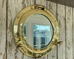 This one has a polished brass finish that ensures its place in any nautical decor style. This porthole has a sturdy,...