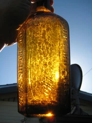 This is one gorgeous honey amber with lots of whitte ! Bottle is hand blown in mold, with applied top. Made aroudn...