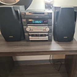 This Aiwa stereo system model CX-ZR774 is perfect for music lovers. With a 5-CD changer capacity, you can enjoy a...