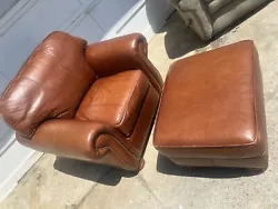 Add a touch of vintage charm to your living room with this Thomasville leather club chair and ottoman set. The rich...