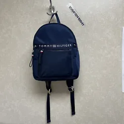 This Tommy Hilfiger backpack is a stylish and functional accessory that every woman needs. The navy blue color with the...
