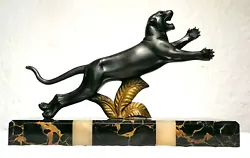 Sculpture période Art Déco. Panthère et feuillage en bronze. Signée H.Gual.