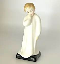 Part of the Royal Doulton Child Classics series, Darling is an adorable boy with an angelic face in night clothes....