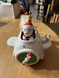 Vintage animated music Santa and reindeer christmas shuttle. The Santa and reindeer alternate going up and down as...