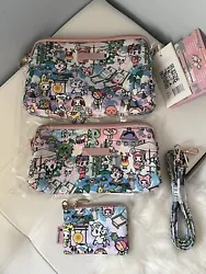 New Toki Retreat Large, Medium set pieces with long strap & coin purse. The medium piece appeared to have a slightly...