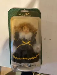 Antique Porcelain doll which has been on a shelf for years 