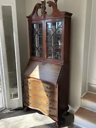 This antique secretary desk with bookcase is a beautiful piece of furniture that will add a touch of history to your...
