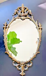 Wonderful antique bronze mirror. Oval shape with beautiful bronze detailing.
