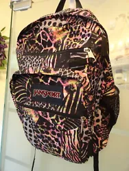 Large black with multicolor print Jansport backpack.  Padded back panel, ergonomic S-curve padded adjustable shoulder...