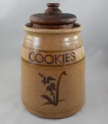 Up for consideration is a vintage artist signed stoneware crock style cookie jar with wooden lid. The piece measures 9...