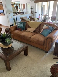 leather couch and chair set. This has some stains but is real leather