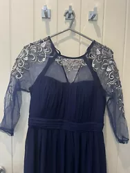 Navy Blue Prom Dress Size 12. Beautiful embroidery with silver sequins. Padded bra cups includedBack zip included. Net...