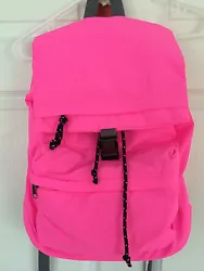 The inside is lined and has a zipper pocket and a couple other pouches. The outside is pink with black pulls. Very Nice.