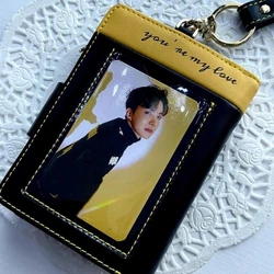 This wallet / wristlet has a black color with yellow trim and stitching. Designs are screen printed and debossed both...