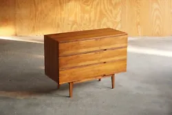 item-A Mel Smilow Walnut Chest, produced 1962. Three oak + mahogany drawer lined drawers. Finished on all sides. Two...
