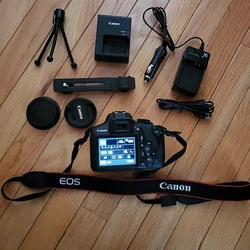 Canon Rebel T6 body with new battery. Flash extension arm. Table tripod.