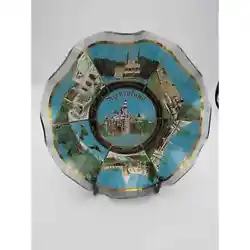 It is made of glass and is principally blue. In the center it shows Sleeping Beautys Castle; along the outside it shows...