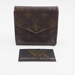 Portefeuille design vintage Billets Coins Tri-Fold de Louis Vuitton en toile Monogram. Le portefeuille est en bon...