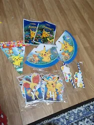 Pokémon Birthday Supplies. Includes 12 party hats, 2 banners that say happy birthday, 1 table banner thats triangle...
