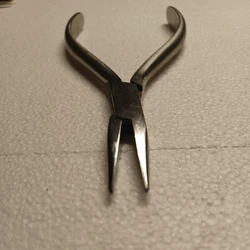 Small gauge wire bending or forming forceps.One side serated other jW is smooth!