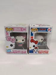 Funko Pop #30 and #31 Hello Kitty Sweet Treat and Hello Kitty 8 Bit NEW IN BOX. Both new in box one has some slight...