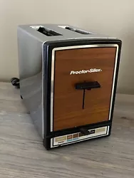 Vintage Proctor-Silex Toaster 2 Slice Woodgrain Bread/Pastry Toaster T649B. Does have a small crack on bottom left...