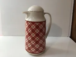 With a classic red plaid pattern and a durable glass and plastic construction, this carafe is perfect for keeping your...