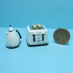 Toaster & Coffee Pot. Toaster buttons work. Great Set for your dollhouse kitchen. Lid on coffee pot is removable.