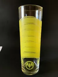 Very nice tall glass with yellow design and the Bacardi Bat logo. Very good condition.